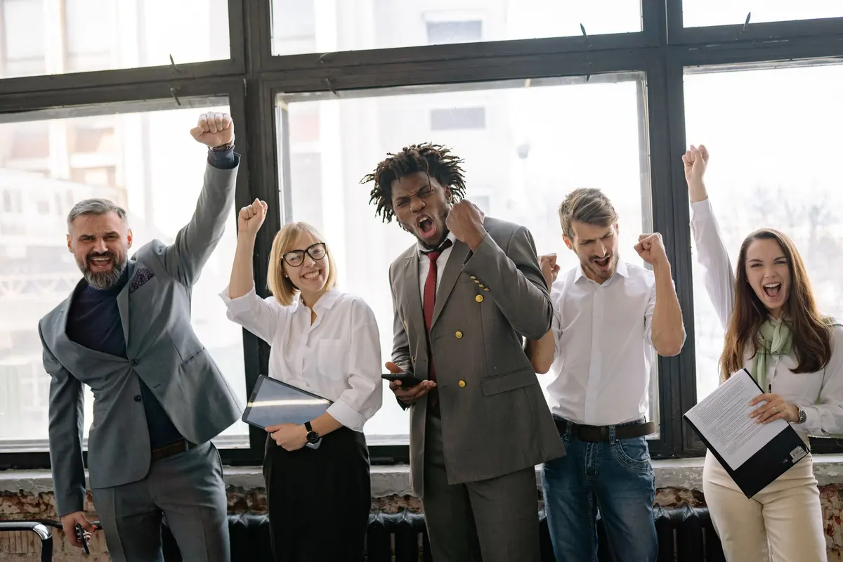 Business team celebrating a win together in the office