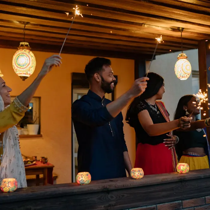 Friends celebrating Diwali together with sparklers