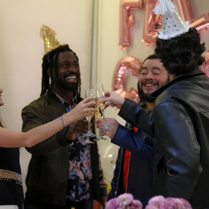 Young colleagues raising a toast to celebrate a milestone